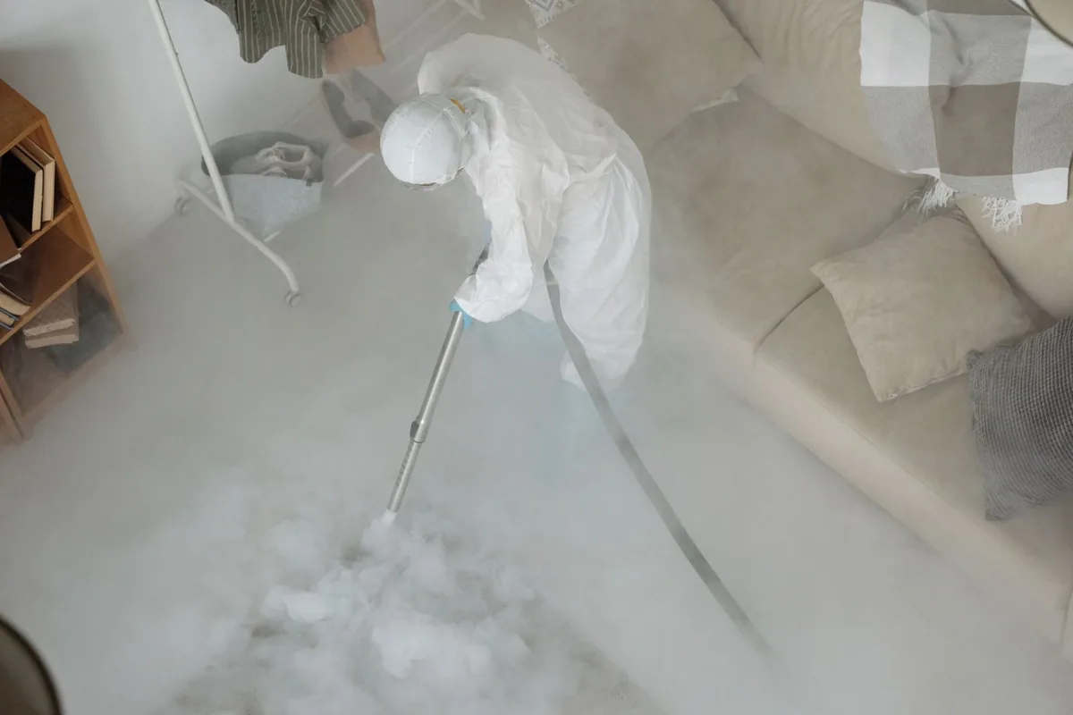 Biohazard cleanup technician in protective equipment, Savannah, GA